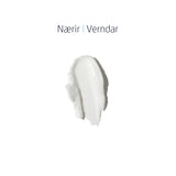Áferð af handáburði sem sýnir slétt, hvítt krem